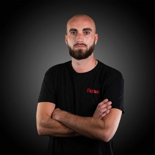 Florian wearing the black Raise Tshirt