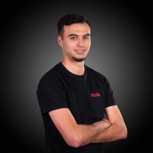 Alexandre wearing the black Raise Tshirt