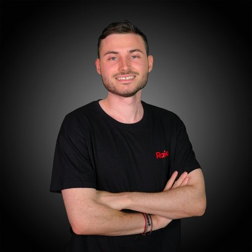 Quentin wearing the black Raise Tshirt