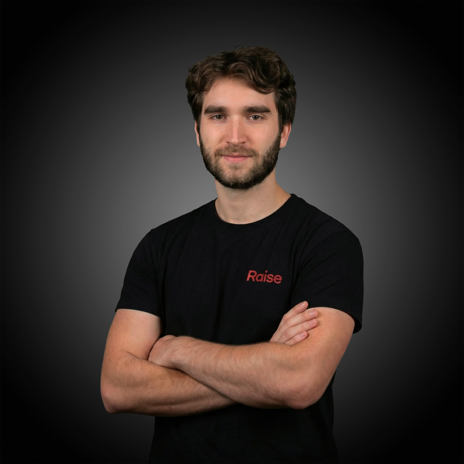 Louis wearing the black Raise Tshirt