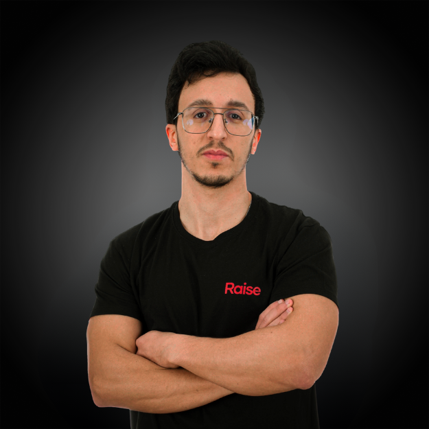 Nassim wearing the black Raise Tshirt